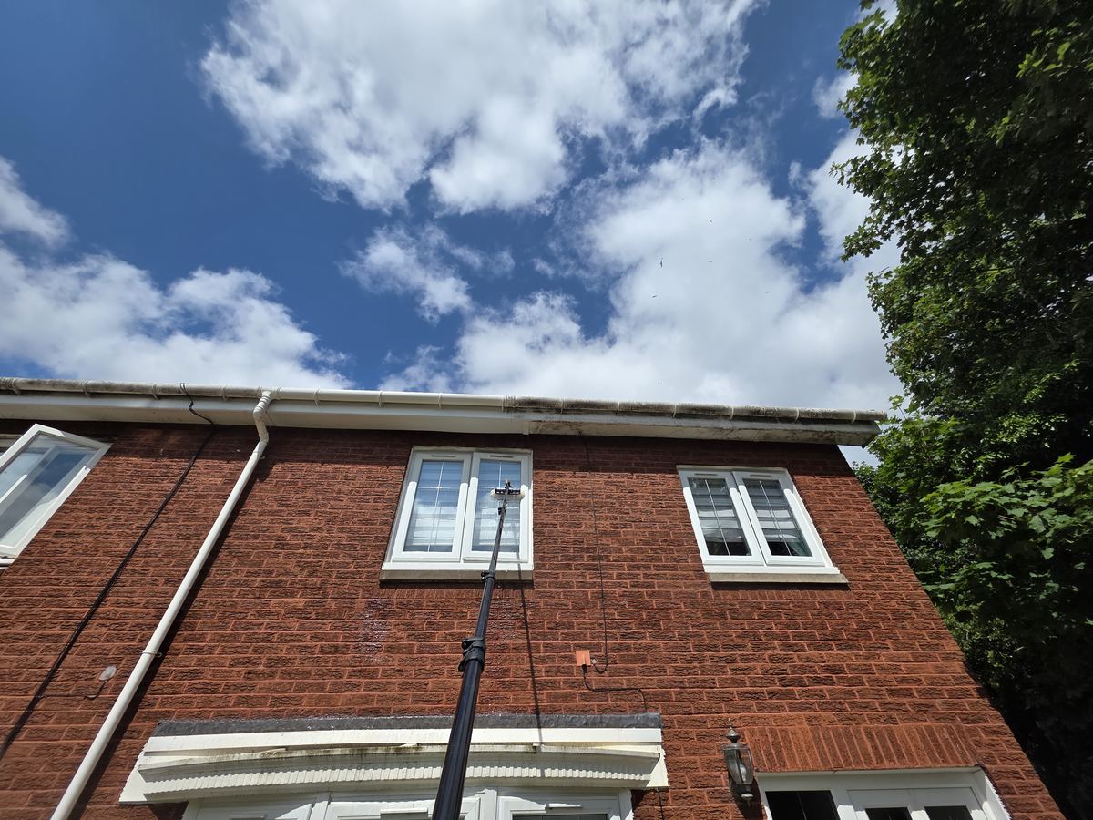 Fascia and soffit clean in progress with the pole system