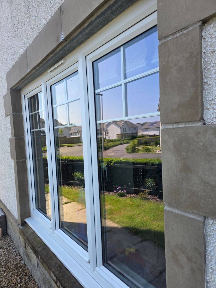 Crystal-clear windows reflecting the street after a clean